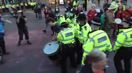 Extinction rebellion arrests obstruction of the highway. police  dismantle  parts of a lorry