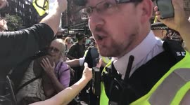 Tempers flare between Extinction Rebellion protesters and police as the protesters block Cambridge Circus in London