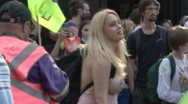 Female Extinction Rebellion protester shows off revealing costume at London demonstration
