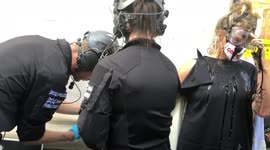 Extinction Rebellion protester gets her glued hand removed from Selfridges by police during protest
