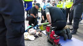Police cut free and arrest Extinction Rebellion XR Cymru Action protesters in London on the 2nd day of their 'The Impossible Rebellion'
