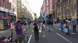 Extinction Rebellion during The Impossible Rebellion protests break their roadblock to allow Fire Engine through in London