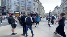 Eco-protesters close Oxford Circus, erect pink structure to lock themselves to