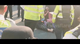 Police specialists begin to remove xr activists glued to the junction of Oxford Circus