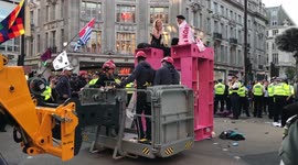 Police use cherrypicker to remove extinction rebellion protestors from blockage