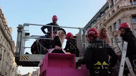 Police remove Extinction Rebellion protesters from London tower