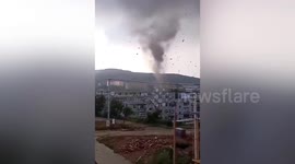 Powerful tornado damages residential buildings and injures 1 in northern China