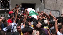 Palestinians carry body of man who died from wounds sustained by Israeli fire