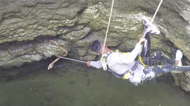 Brave rescuer lowered into 100-feet-deep well to retrieve deadly cobra