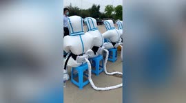 Protective clothing fitted with portable air conditioners launched in central China