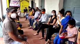 Locals get stamps for getting vaccinated in central India