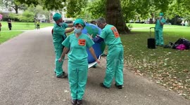 Extinction Rebellion ‘Planet Medics' try to revive 'planet Earth' with a 'defibrillator' during the demonstration in St James's Park, London 26/08/2021