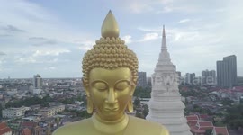 Aerial footage of a recently completed giant gold Buddha statue, the height of a 20-storey building towering over Bangkok, Thailand
