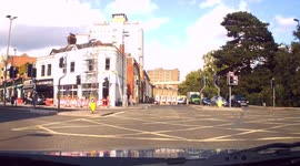 DASHCAM - Deliveroo Rider jumps Red Light and has to stop in middle of box junction due to traffic.