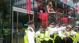Extinction Rebellion activists daub Standard Chartered bank in red paint