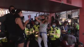 Extinction rebellion women refuse to leave faints gets arrested and carried out