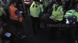 arrests coming from all angles Extinction rebellion met police carry them out of the area