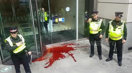 Extinction Rebellion protesters burst balloon full of fake blood in City of London