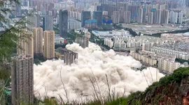 Watch moment 15 tower blocks get demolished simultaneously in China
