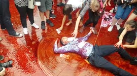 Vampiric protester parties in fake blood during Extinction Rebellion in London