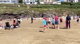 People enjoy Polzeath beach on eve of August Bank holiday in Cornwall