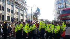 Wild moments at Extinction Rebellion protest in London include blood money, dancers and more