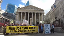 Extinction Rebellion Grandparents sing outside the Bank of England before the Blood Money march in London