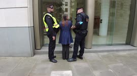 Woman arrested during the Extinction Rebellions Blood Money March in London