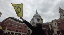 Extinction Rebellion protesters boogie by St Paul's Cathedral during their 'Blood Money March
