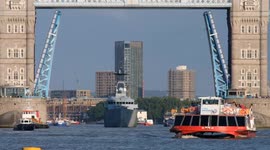 HMS Severn passes through Tower Bridge into London for recommissioning ceremony