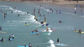 Surfers and holidaymakers flock to Polzeath in Cornwall for Bank holiday weekend