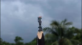 Micro Artist make micro sculpture on pencil lead holding Indian flag within Three hours in Southern India