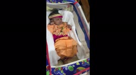 In Indian family celibrate Janmashtami with Children as a lord Krishna