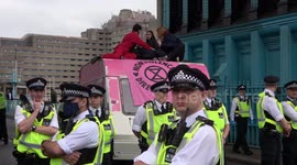 Protestors having a tea party moved off Tower Bridge to 'create a sterile area' according to police officers at the Extinction Rebellion protest in London