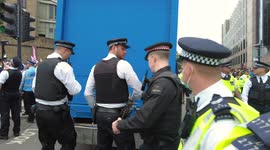 Police struggle to open protesters van blocking Tower Bridge Approach during Extinction Rebellion's The Impossible Tea Party