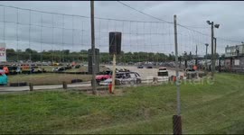 Cars banger racing around the track at high speed