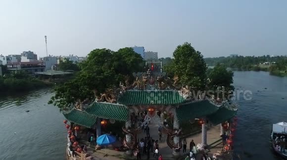 Unique temple in the middle of the river in Vietnam, guests have to take a boat to cross the river to visit the temple