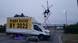 Aylesbury, UK. 31 August 2021. Animal Rebellion blockaded the entrance to Arla Aylesbury with bamboo structures, concrete blocks and a van.