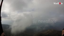'Paragliding Fail | Pilot Botches Landing After Crashing into Trees'