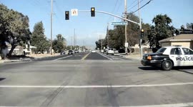 POLICE ON SCENE: Car runs red light but gets away with it as police pass seconds later without seeing it