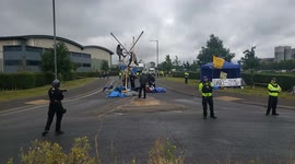 Aylesbury, UK. 31 August 2021. Animal Rebellion blockaded the entrance to Arla Aylesbury with bamboo structures, concrete blocks and a van.