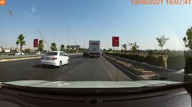 WTF MOMENT: Heart-stopping moment truck nearly crushes car in his blind spot on Iraq highway