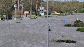 As streets become lakes, locals use boats to get around LaPlace, Louisiana, after Hurricane Ida