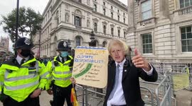 Boris Johnson masked protester joins Extinction Rebellion occupation outside Downing Street