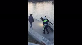 POLICE ON SCENE: Not on my patrol you don't! Angry Russian cop confronts idiot biker riding along walkway