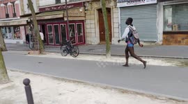 A strange man walks at a brisk pace in very tiny boxer shorts and barefoot in the streets of Paris.31aug2021