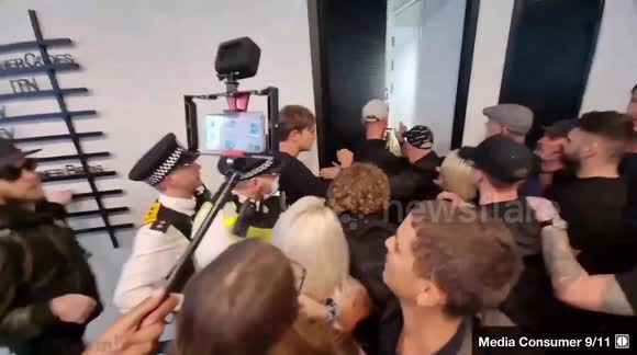 Anti-Vaccine Protestors Scuffle With Police At ITN Headquarters