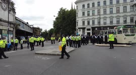 Extinction Rebellion protesters on an open top bus block the junction on the south side of London Bridge causing major disruption and road closures