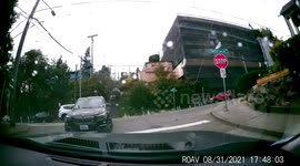 BMW SUV Driver makes mistake and takes large turn on busy Seattle intersection