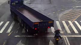 Helmet saves motorcyclist's life after truck's trailer slams into his head